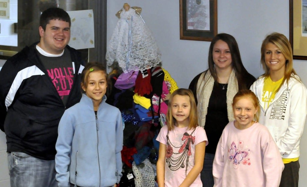 2012 STUDENT COUNCIL MITTEN TREE … Students and staff at Edon Northwest Local Schools recently completed the annual Angel Tree project by collecting cold-weather apparel for local children. Gathered around the tree, decorated with nearly one hundred fifty items are front, from left, Brianna Heinze, Tatum Workman, Maicie Blade and back, from left, David Headley, Mariah Hantz and Sydney Stoll. All hats, mittens, scarves and gloves were donated to Edon Area Ministerial Association for its A Caring Christmas ministry.