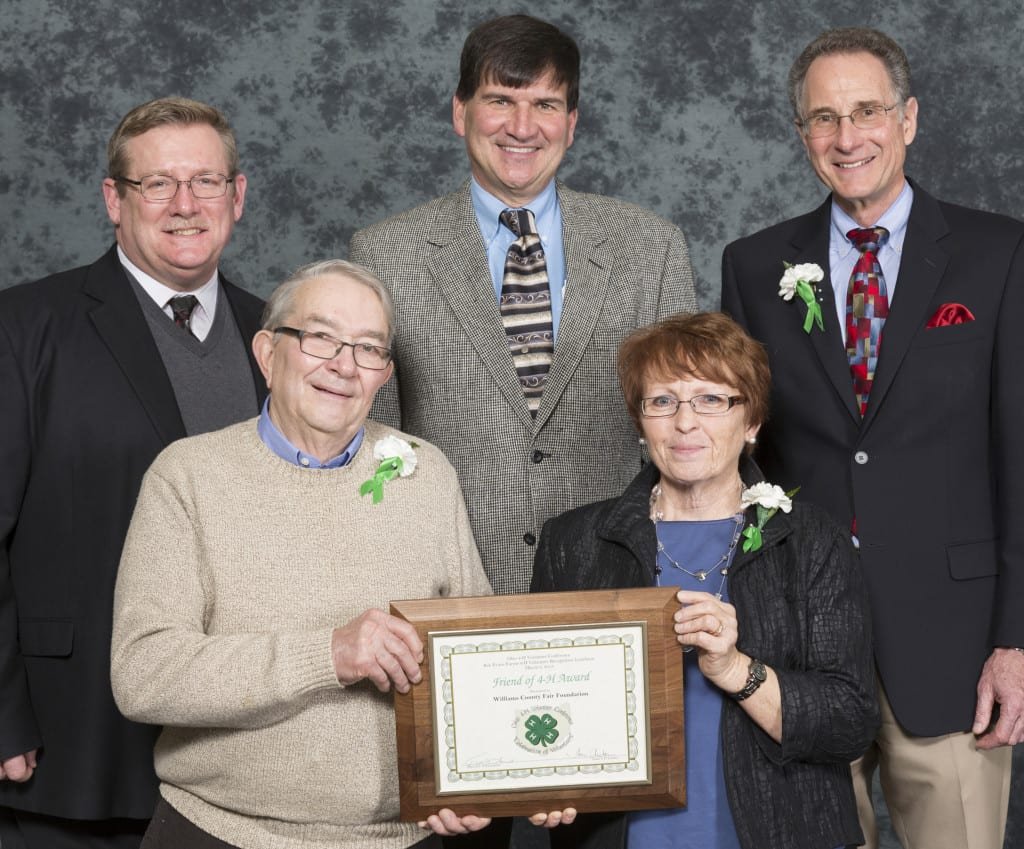 Back row pictured from the left: Dale Arnold, Chairman, Ohio 4-H Foundation Grants Committee; Mike Westfall, Farm Credit Mid-America, Award Sponsor; and Keith Smith, Director, Ohio State University Extension. Front row pictured from the left: Arthur Follett and Jan Follett of Montpelier in Williams County.
