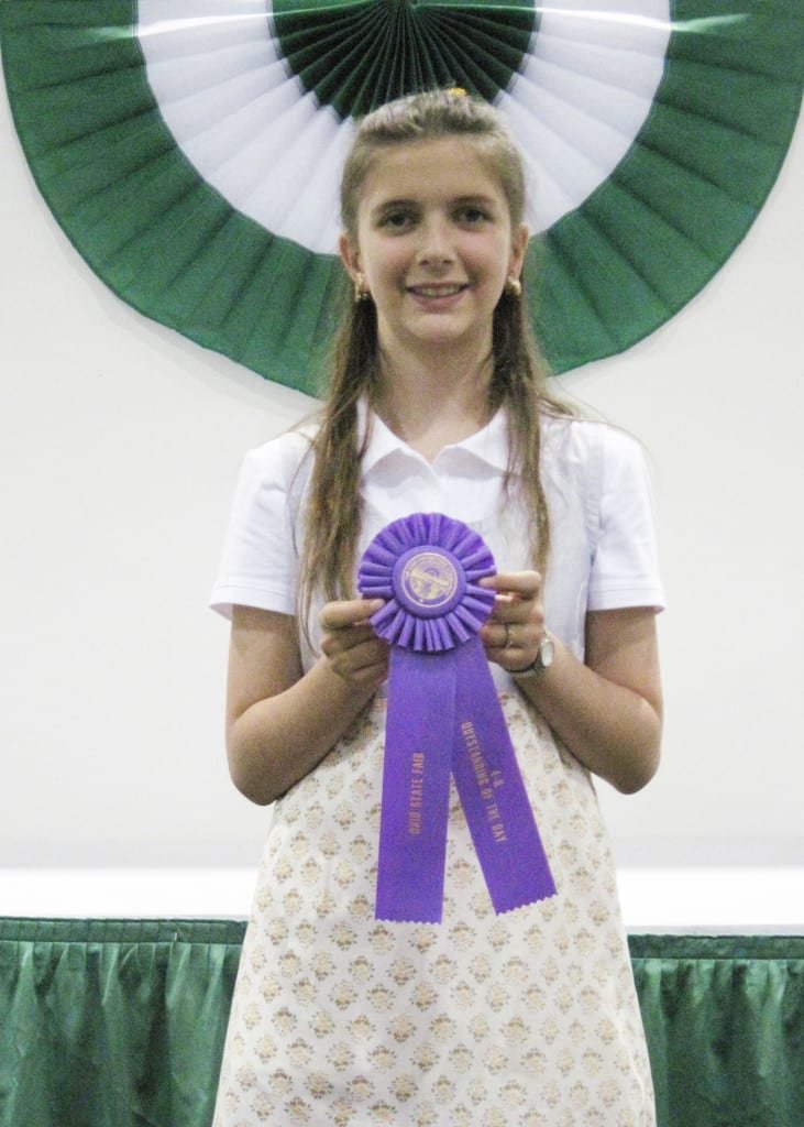 4-H Outstanding of the Day award ... On Thursday, July 25, 2013, eleven year old Jaelina Mitchell, member of the Stryker Livestock 4-H Club, entered her 4-H project, Scrapbooking-Jr, in the Ohio State Fair, 4-H competition. This was Jaelina’s first trip to State Competition. She placed as a Finalist and was awarded an Outstanding of the Day ribbon. Jaelina is the daughter of Gayland and Toni Mitchell.