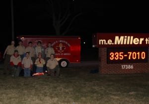TIRE DONATIONS ... Scouts and Troop Leader from Troop 8 show off the new trailer tires and jack that were so generously donated
