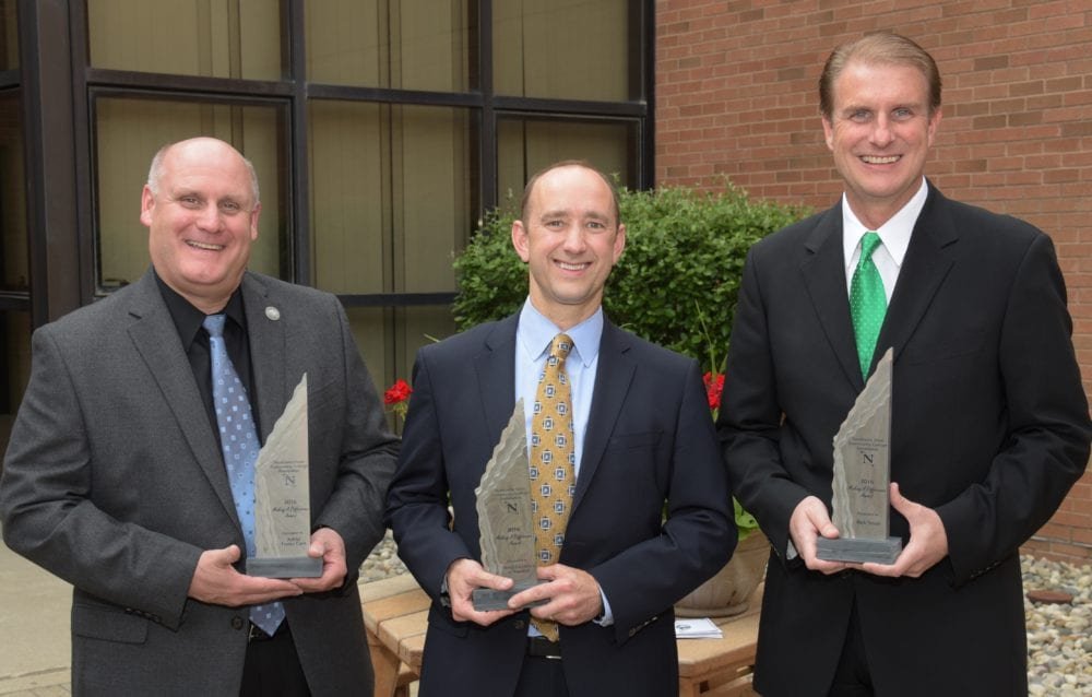 Todd Hanes, President and CEO of Adriel, Dr. Michael Carpenter, Dental Excellence of Napoleon and Rick Small, WDFM/Mix 98.1, holding their 2016 Making a Difference Awards.